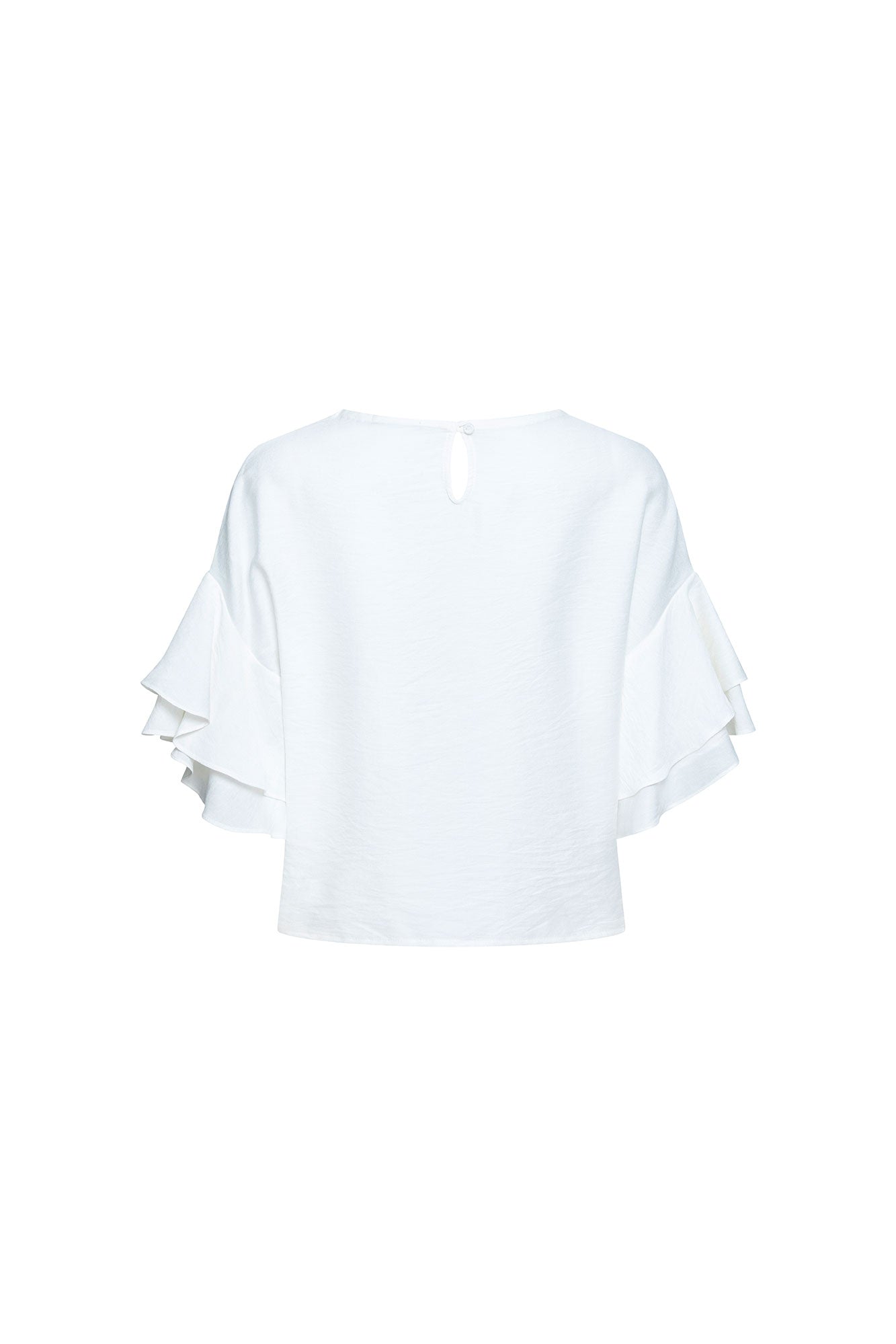 The Gola Doble — back view showing clean boxy silhouette, back keyhole closure with single button and Bettina Spitz label at collar, with triple-tiered ruffle sleeves visible at sides