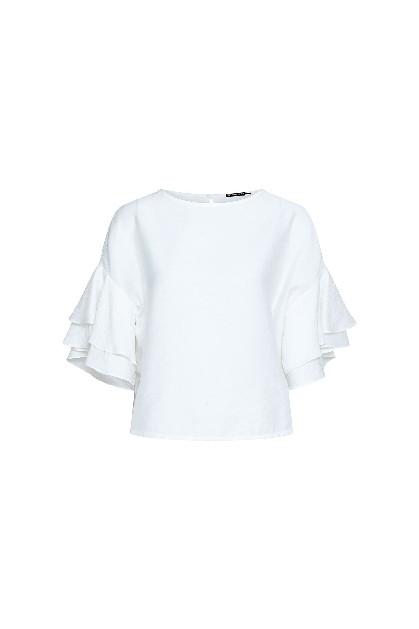 The Gola Doble White Blouse — full front view showing relaxed boxy silhouette with clean jewel neckline and triple-tiered cascading ruffle sleeves