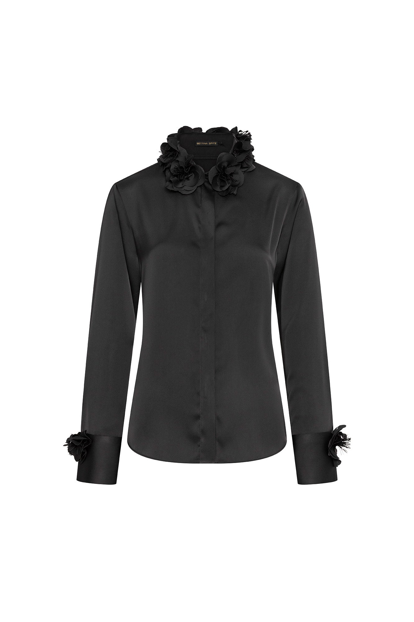 The Verónica Black Satin Blouse — front view with full 3D black rose collar garland and concealed placket