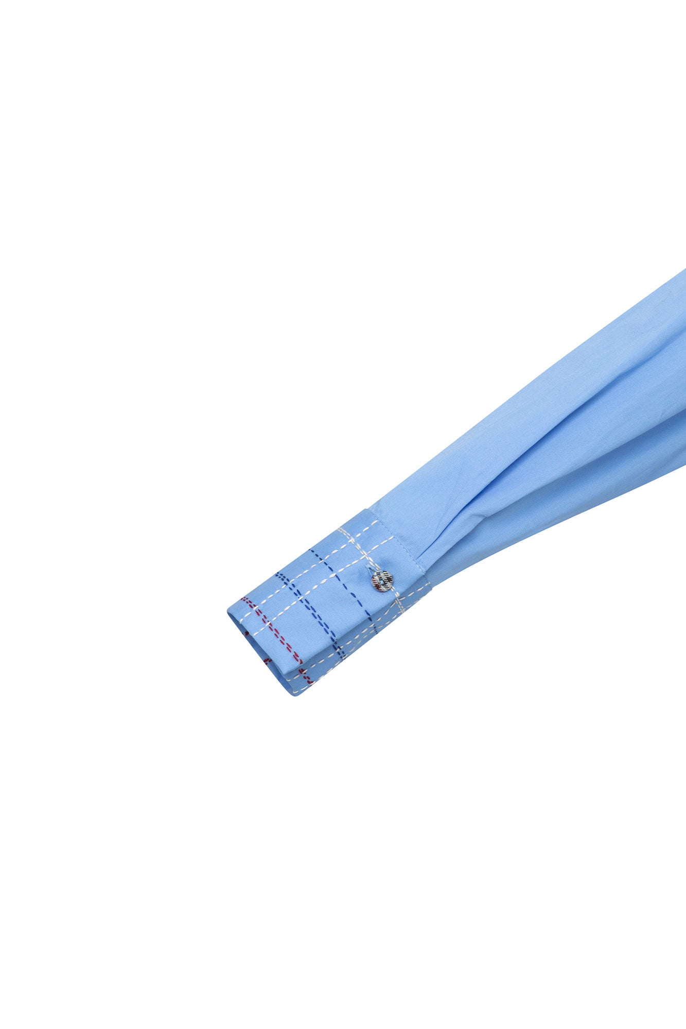 Close-up of sky-blue shirt cuff with contrast check stitching and decorative fastening