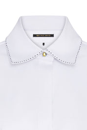 The Sol Flor White Shirt — close-up of hand-embroidered wildflower sleeve detail with multi-colour thread and bead embroidery