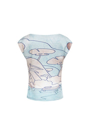 Back view of pale-blue Carlota top with navy line drawings of trees, boats and water
