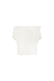 Crop Sisa Flores Ivory — full back view showing fitted ivory cropped sleeveless top with center back keyhole closure, wide bateau neckline at back, and 3D fabric flower columns running along both armhole edges