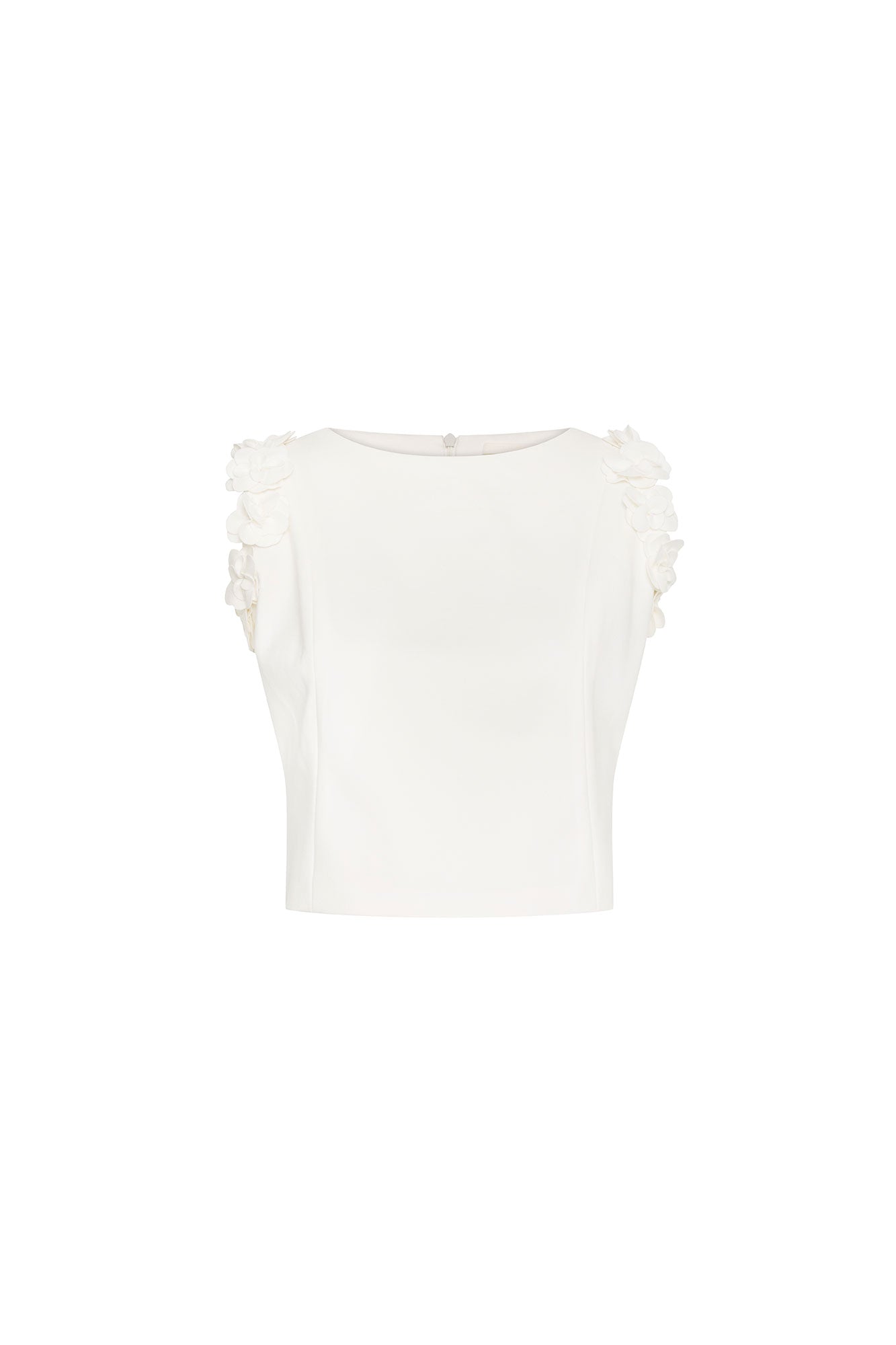 Crop Sisa Flores Ivory — full front view showing fitted ivory cropped sleeveless top with wide bateau neckline and continuous column of hand-applied 3D fabric flowers along both armhole edges, plain ivory body below