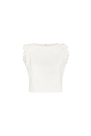 Crop Sisa Flores Ivory — full front view showing fitted ivory cropped sleeveless top with wide bateau neckline and continuous column of hand-applied 3D fabric flowers along both armhole edges, plain ivory body below