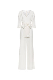 The Enterizo V Ivory Wide-Leg Jumpsuit — full front view with V-neckline, tie belt bow and wide-leg trousers