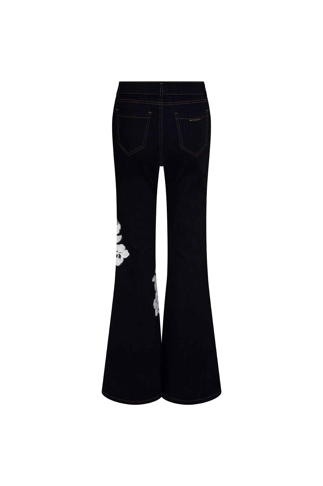 The Jean Campana Flor Hilo Navy — full back view showing five-pocket dark navy stretch denim flare jeans with contrast topstitching, Bettina Spitz label at inner waistband, and white botanical embroidery visible on back left flare panel
