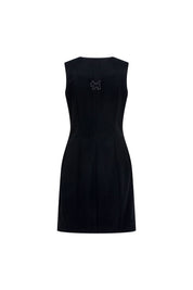The Jumper Perrito Pespunte Negro — back view showing smooth structured black crepe fitted silhouette with BS Bettina Spitz silver logo label at center back neckline and crystal stud trim along bateau neckline edge
