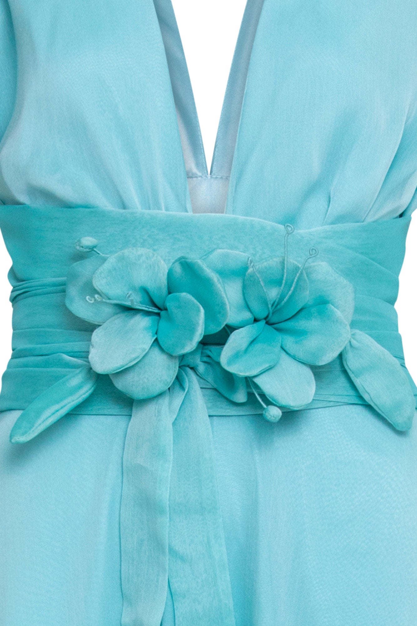 The Lazo Flor — close-up of wide aqua satin sash showing two handmade 3D aqua fabric flowers with individually shaped petals and pearl-tipped wire stamens placed at the center sash knot