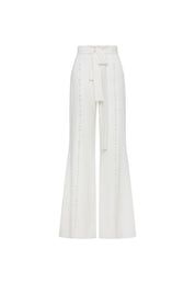Front view of Bettina Spitz ivory high-waisted wide-leg trousers with tie belt and tonal button rows