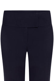 Pantalón Haches Navy — close-up of front waistband showing wide double-panel high-rise construction with clean horizontal seam and no hardware
