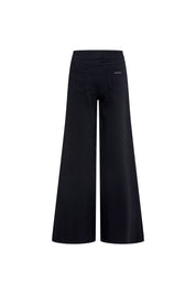 The Nadadora Black Wide-Leg Graphic Pants — front view with pop-art swimmer panel