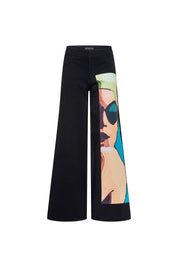 The Nadadora Black Wide-Leg Graphic Pants — back pocket detail with Bettina Spitz label