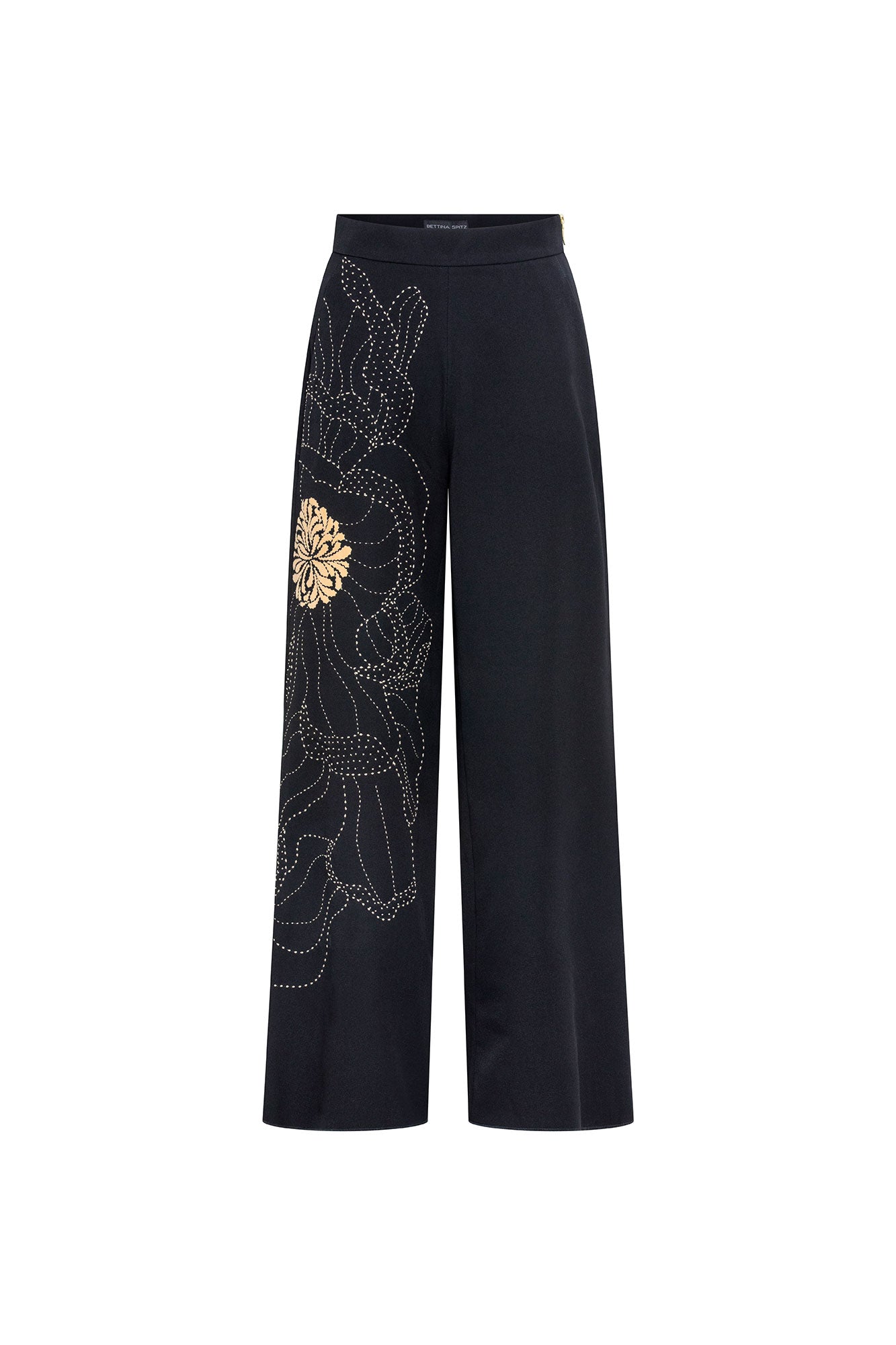 The Milo Black Wide-Leg Pants — front view with large-scale floral embroidery on left leg