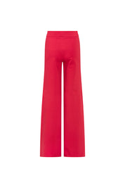 Back view of red high-waisted trousers with fitted hips and long wide legs