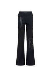 The Patch Campana Black Flare Trouser — full front view showing high-rise waistband, fitted leg opening into floor-length flare, white contrast topstitching throughout, front hip patch pockets and thigh panel pockets with gold D-rings