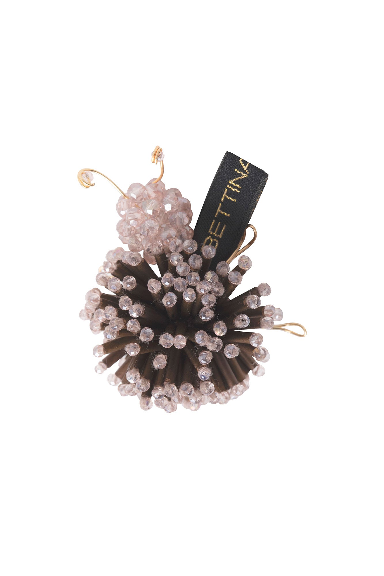 Close-up of Bettina Spitz Catarina brooch with dark brown strips, pale pink beads and gold-toned wire legs and antennae