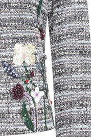 The Michell Jardín Grey Tweed Jacket — close-up of hand-beaded botanical embroidery with pearl flowers, burgundy roses, pink blossoms and green sequin stems
