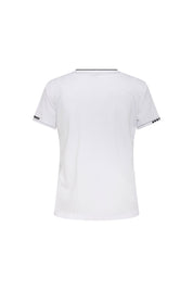 The T-Shirt Vivo Pespunte Flores Blanco — full back view showing fitted white cotton t-shirt with black neckline band and Bettina Spitz label woven into band at center back, black trim at sleeve hems with dotted white topstitch and daisy flower cluster at outer cuff edge