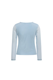 Back view of sky-blue fitted top with sheer long sleeves and embellished cuffs