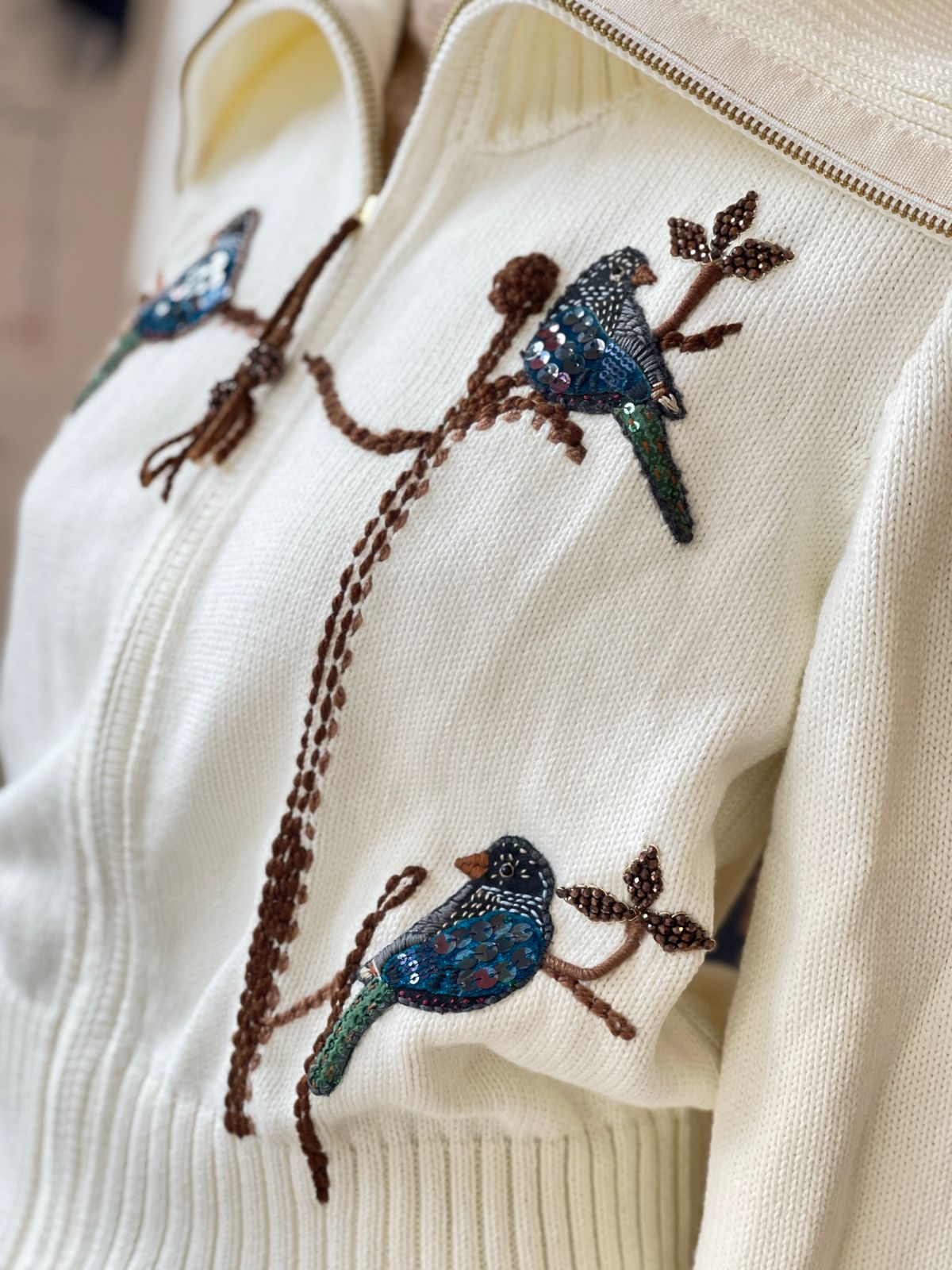 The Azulejos — close-up of three dimensional hand-embroidered kingfisher birds in teal and blue sequins with green tail feathers and brown seed bead branch vine